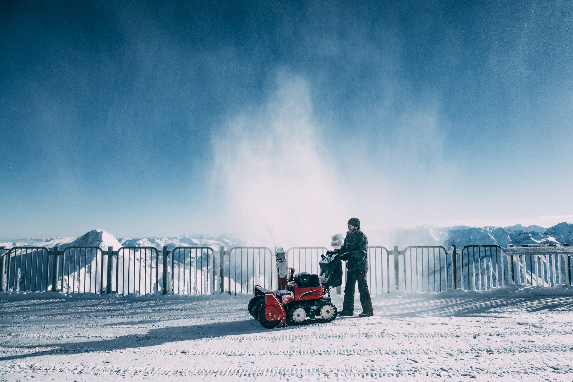 MAYRHOFEN, AUSTRIA – FEBRUARY 19, 2018: Man working with snow blowing machine in mayrhofen ski area,
